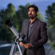 Rahul Kohli with a telescope in Midnight Club.